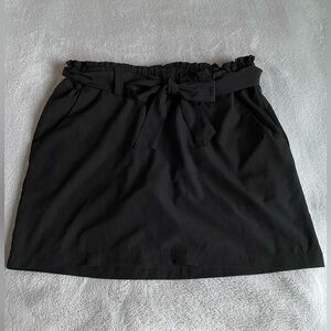 RBX black athletic skort with stretchy waistband with tie. Size Medium